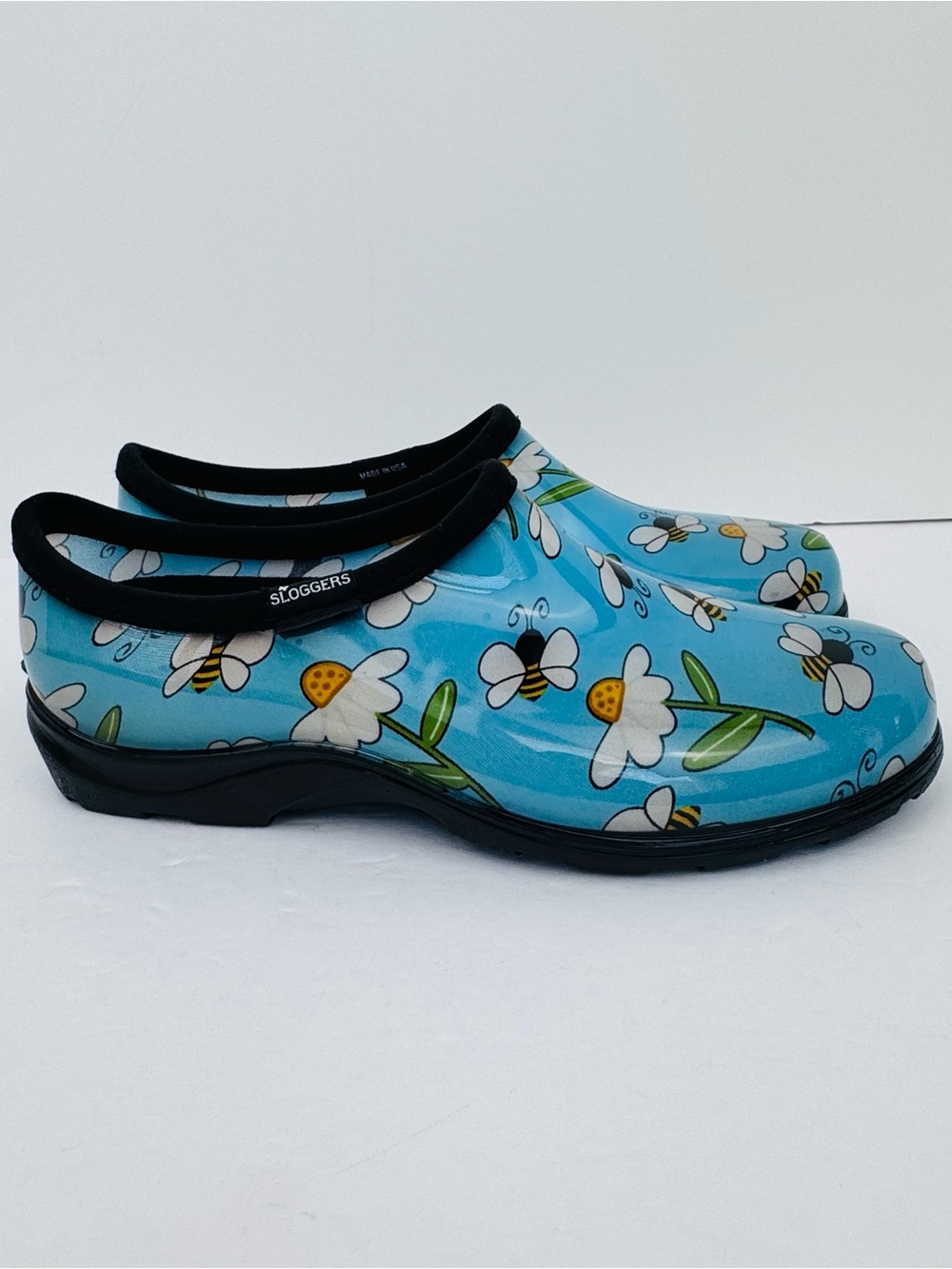Sloggers women's garden clogs featuring a Floral and bee print. Size 10.